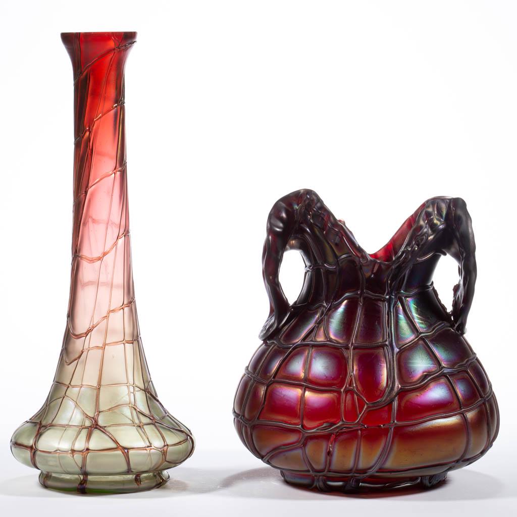 PALLME-KONIG VEINED ART GLASS VASES, LOT OF TWO: PALLME-KONIG VEINED ART GLASS VASES, LOT OF TWO, comprising a ruby iridescent bulbous form with pulled petal handles, and a green and ruby iridescent bud form. Bohemia, now Czech Republic. First quart