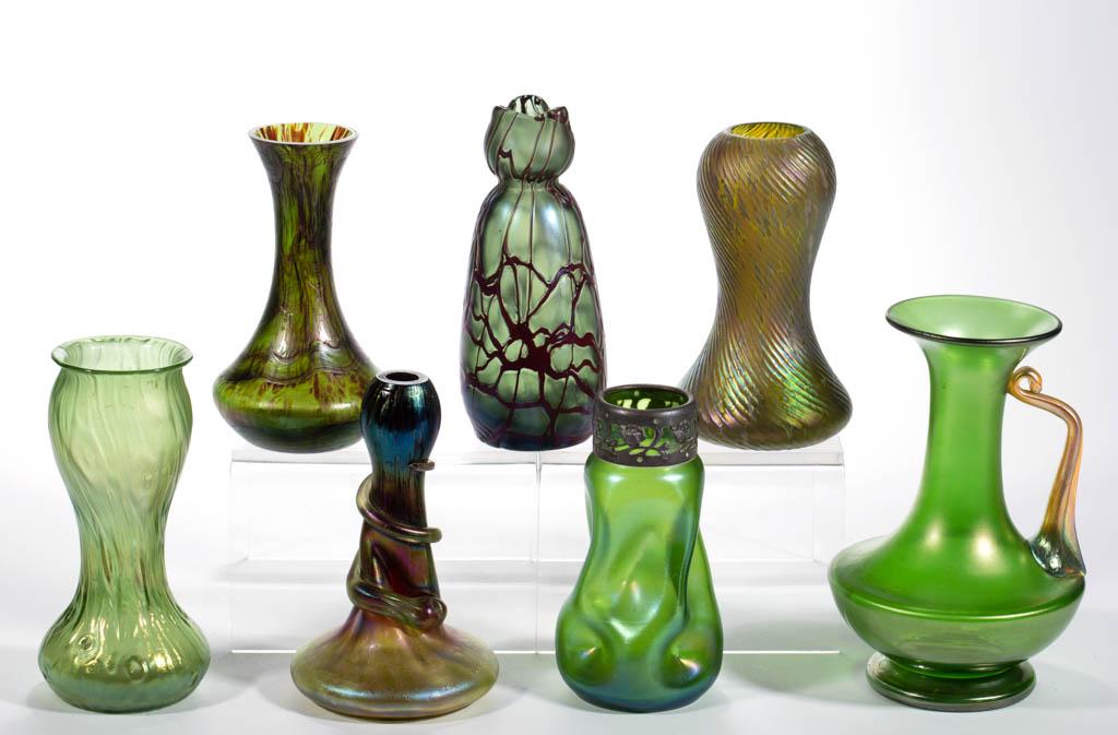 ASSORTED BOHEMIAN ART GLASS ARTICLES, LOT OF SEVEN: ASSORTED BOHEMIAN ART GLASS ARTICLES, LOT OF SEVEN, green iridescent, including a Loetz Rusticana vase, a Kralik Snakeskin vase, and a Pallme-Konig vase. Bohemia, now Czech Republic. First quarter 20t