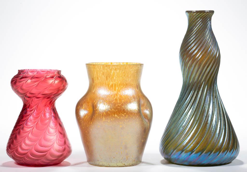 ASSORTED BOHEMIAN IRIDESCENT ART GLASS VASES, LOT OF: ASSORTED BOHEMIAN IRIDESCENT ART GLASS VASES, LOT OF THREE, comprising a golden iridescent Loetz-type Papillon, a green iridescent Loetz Swirl, and a pink embossed wave. Bohemia, now Czech Republic. 2