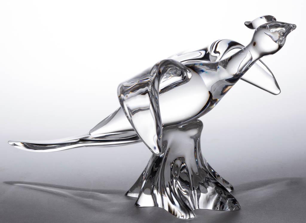 STEUBEN PHEASANT ART GLASS SCULPTURE: STEUBEN PHEASANT ART GLASS SCULPTURE, colorless, large flying pheasant with two arched wings and a long tail, raised on the ribbed base, signed "Steuben" to the underside. Steuben Glass Works. 20th ce