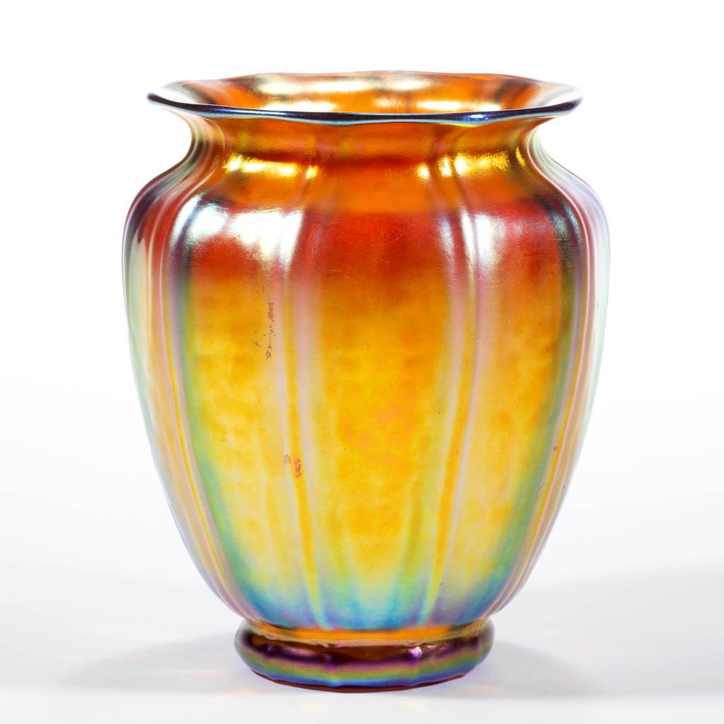 STEUBEN AURENE IRIDESCENT ART GLASS VASE: STEUBEN AURENE IRIDESCENT ART GLASS VASE, Gold Aurene, lamp shade form with ten vertical ribs, polished pontil mark. Steuben Glass Works. First quarter 20th century. 5" H.Undamaged.Provenance: From th