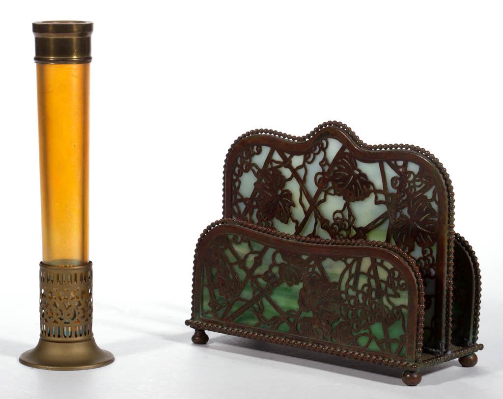 ASSORTED TIFFANY STUDIOS ART GLASS ARTICLES, LOT OF TWO: ASSORTED TIFFANY STUDIOS ART GLASS ARTICLES, LOT OF TWO, comprising a golden iridescent stick vase fitted with a bronze collar and set into a bronze base, signed "L.C.T. Favrile" to the underside; and