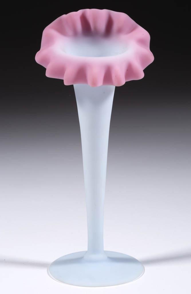 MT. WASHINGTON PEACHBLOW CRIMPED LILY VASE: MT. WASHINGTON PEACHBLOW CRIMPED LILY VASE, dusty rose to pale blue with plush finish, jack-in-the-pulpit form, polished pontil mark. Mt. Washington Glass Co. 1886-1890. 7" H. Undamaged. Literature: B