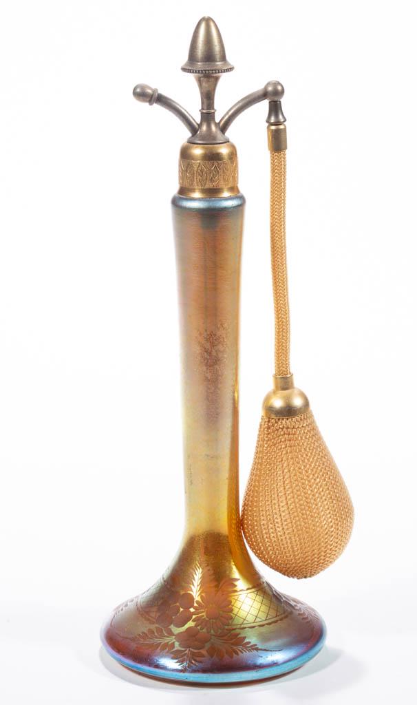 STEUBEN GOLD AURENE IRIDESCENT ART GLASS ATOMIZER: STEUBEN GOLD AURENE IRIDESCENT ART GLASS ATOMIZER, Gold Aurene with engraved floral decoration, shape 6407, with a period mount, top, and bulb apparatus, polished pontil mark. Steuben Glass Works. Fir