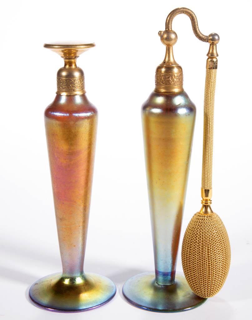 GOLDEN IRIDESCENT ART GLASS ATOMIZER AND PERFUME: GOLDEN IRIDESCENT ART GLASS ATOMIZER AND PERFUME BOTTLE, LOT OF TWO, comprising two tapered form examples with each having a period mount and top, one having a bulb apparatus and the other having a lo
