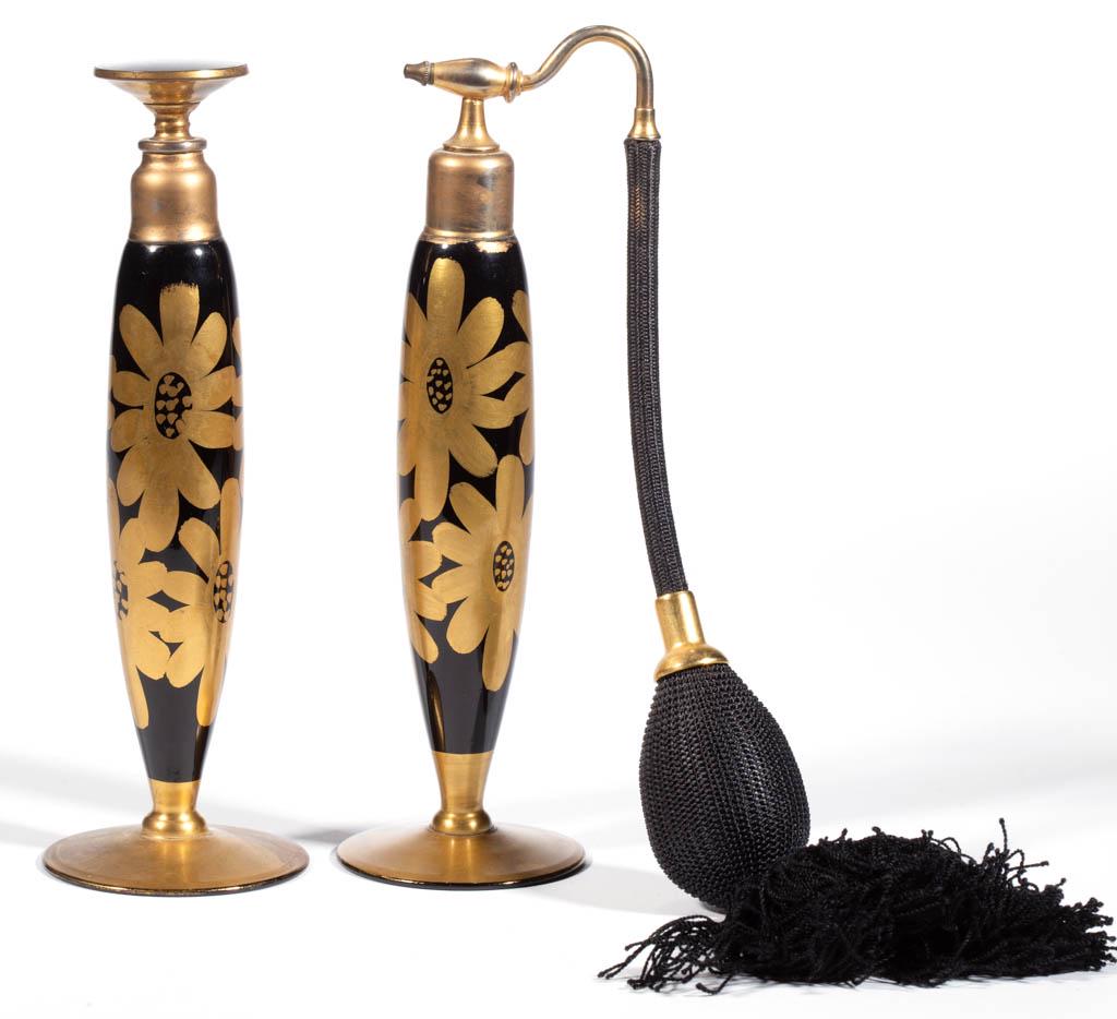 DEVILBISS FLORAL DECORATED ATOMIZER AND PERFUME BOTTLE: DEVILBISS FLORAL DECORATED ATOMIZER AND PERFUME BOTTLE, black with gilt decoration, each with an ovoid form body and matching decoration, each having a period mount, one having a period top and bulb a