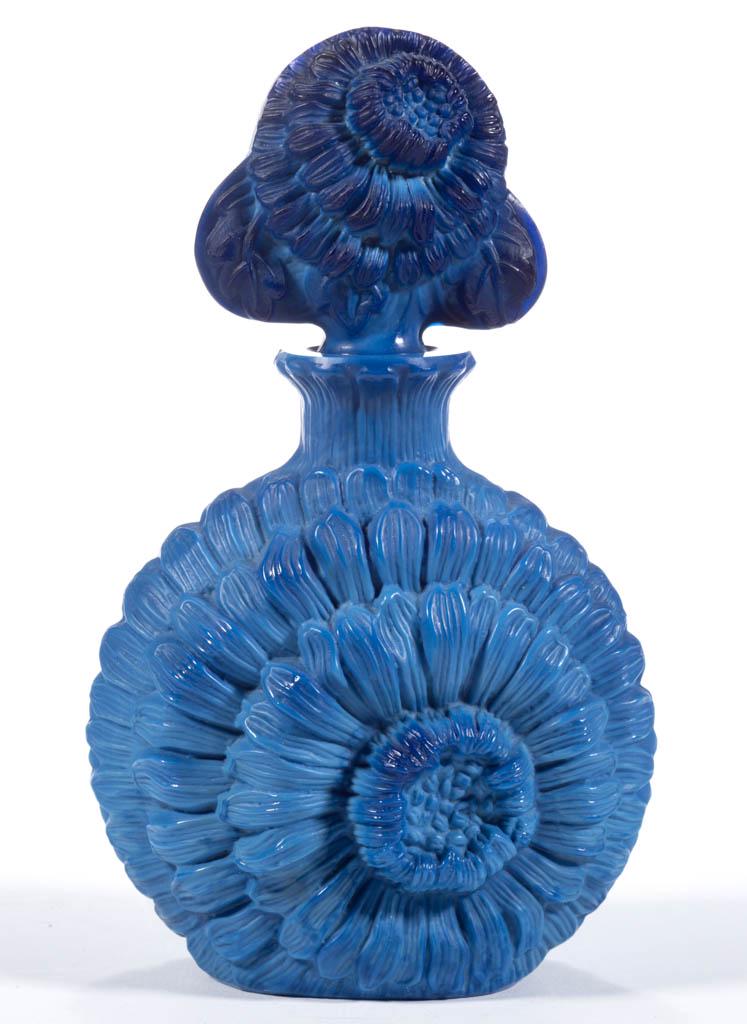 CZECH LAPIS FLORAL PERFUME BOTTLE: CZECH LAPIS FLORAL PERFUME BOTTLE, lapis, circular bottle depicting a bloomed flower, original matching stopper. Czech Republic. First half 20th century. 5 3/4" HOA, 3 3/4" H bottle. Nearly undamaged 
