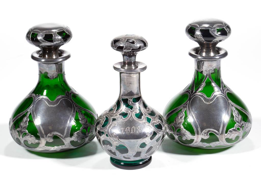 AMERICAN ART NOUVEAU SILVER-OVERLAY AND GLASS PERFUME: AMERICAN ART NOUVEAU SILVER-OVERLAY AND GLASS PERFUME BOTTLES, LOT OF THREE, green and emerald green, comprising two Gorham examples, each having matching foliate and meandering scroll designs, overla