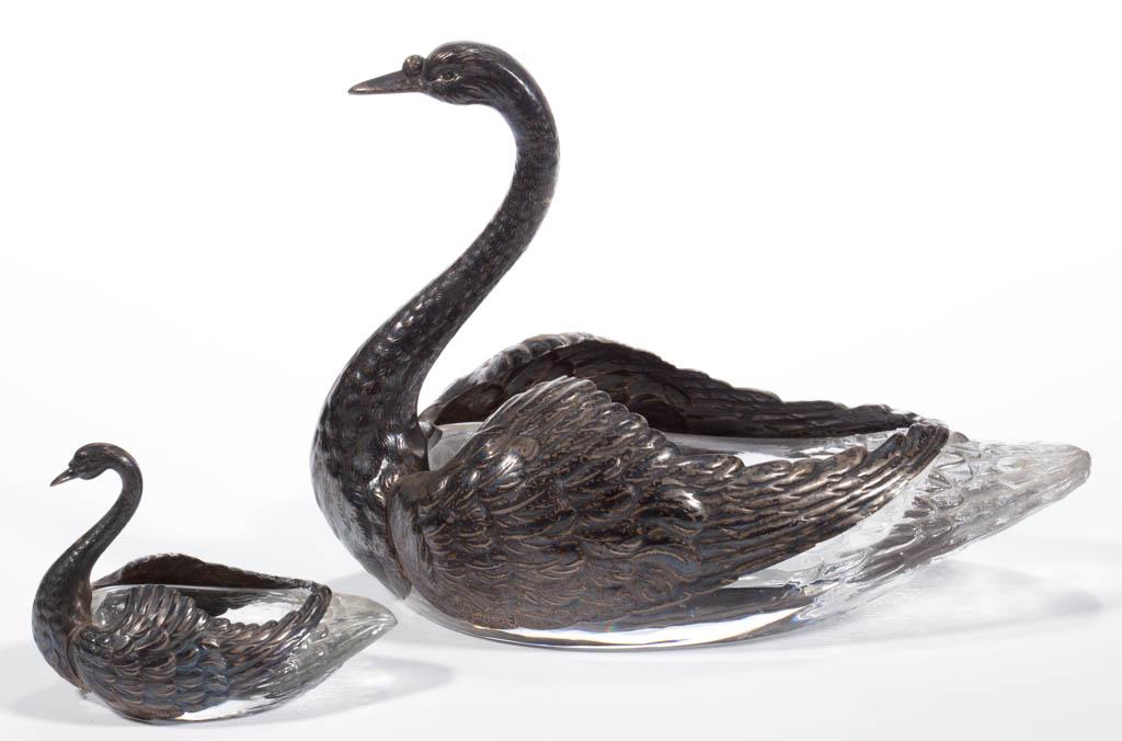 FIGURAL SWAN PRESSED GLASS AND SILVER-OVERLAY DISHES,: FIGURAL SWAN PRESSED GLASS AND SILVER-OVERLAY DISHES, LOT OF TWO, colorless, comprising a large and a small size with a pressed body and silver head, neck, and wings, each marked "STERLING", larger ex