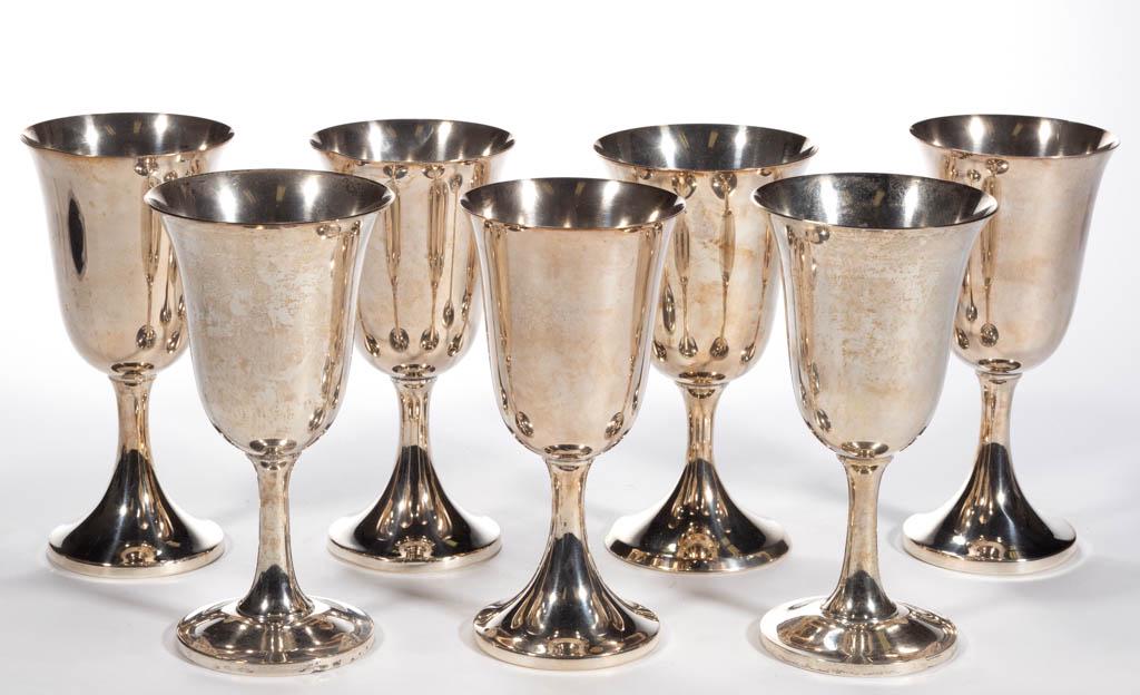 ASSORTED STERLING SILVER WATER GOBLETS, LOT OF SEVEN: ASSORTED STERLING SILVER WATER GOBLETS, LOT OF SEVEN, each having a semi-ovoid bowl, raised on a stemmed base, including two by Wallace Silversmiths and one by The Stieff Co. Each with "STERLING" mark