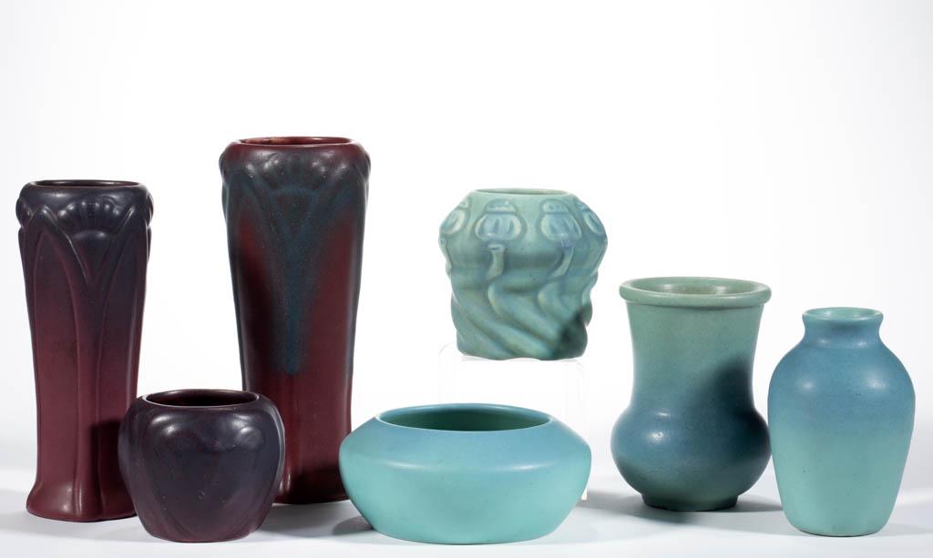 VAN BRIGGLE ART POTTERY ARTICLES, LOT OF SEVEN: VAN BRIGGLE ART POTTERY ARTICLES, LOT OF SEVEN, comprising three vases having "Mulberry" red/purple glaze, including two featuring fan-like decorations and one with three bas-relief butterflies, and f