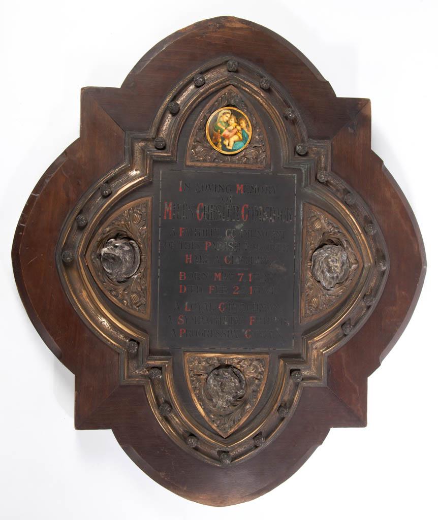 AMERICAN COMMEMORATIVE ARCHITECTURAL WALL PLAQUE /: AMERICAN COMMEMORATIVE ARCHITECTURAL WALL PLAQUE / TABLET, walnut frame with metal plaque commemorating "Miles Chester Comstock", flanked by symbols of the Gospel writers, Ox (Luke), Lion (Mark), and 