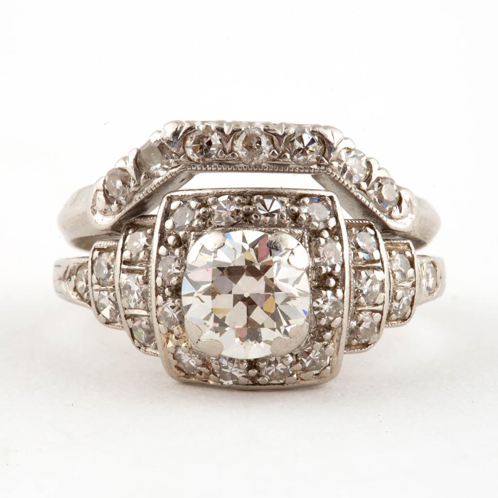VINTAGE PLATINUM AND DIAMOND WEDDING RING SET: VINTAGE PLATINUM AND DIAMOND WEDDING RING SET, ring having a filigree gallery, featuring a central old European-cut diamond measuring approximately 5.64-5.68 x 3.6 mm, calculated weight of 0.73 ct., c