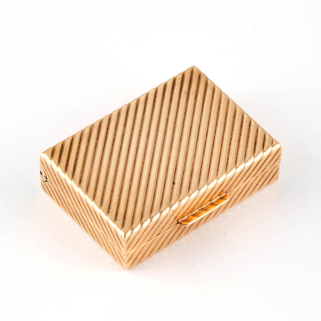 VINTAGE 14K YELLOW GOLD PILL BOX: VINTAGE 14K YELLOW GOLD PILL BOX, rectangular form having a diagonal ribbed exterior and a hinged lid. Marked "14K" to interior flange. Total weight: 20.4 grams. 20th century. 1 3/8" x 1" x 3/8" OA. (
