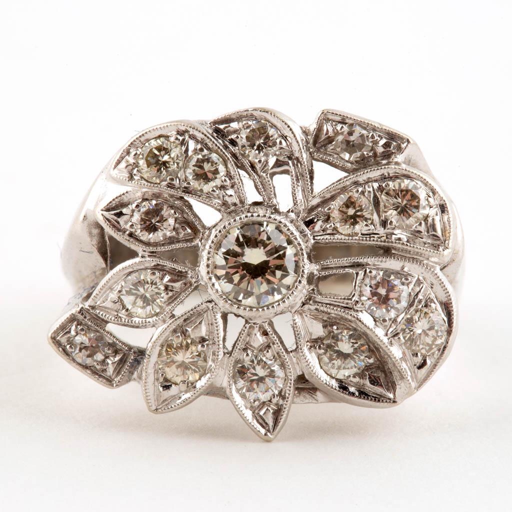 VINTAGE 14K WHITE GOLD AND DIAMOND LADY'S RING: VINTAGE 14K WHITE GOLD AND DIAMOND LADY'S RING, cluster-style mounting having a floral motif design; featuring one round brilliant-cut diamond measuring approximately 4.20 x 2.35 mm, calculated weight