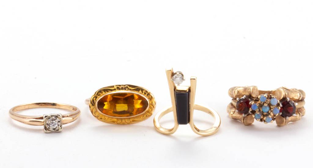 VINTAGE 14K YELLOW GOLD RINGS, LOT OF FOUR: VINTAGE 14K YELLOW GOLD RINGS, LOT OF FOUR, comprising a solitaire example featuring a melee diamond in a square illusion setting, an abstract-designed example featuring a melee diamond in four-prong