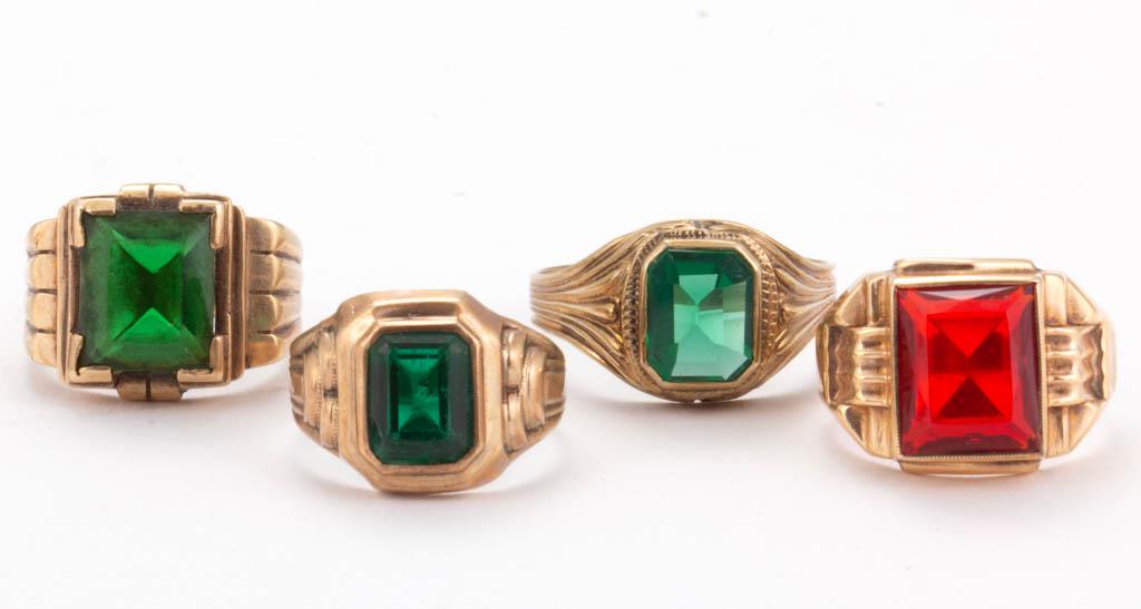 VINTAGE 10K AND 14K YELLOW GOLD AND GLASS MEN'S RINGS,: VINTAGE 10K AND 14K YELLOW GOLD AND GLASS MEN'S RINGS, LOT OF FOUR, comprising one 14K example with a green glass stone and three 10K examples with one having a red glass stone and two with green glas