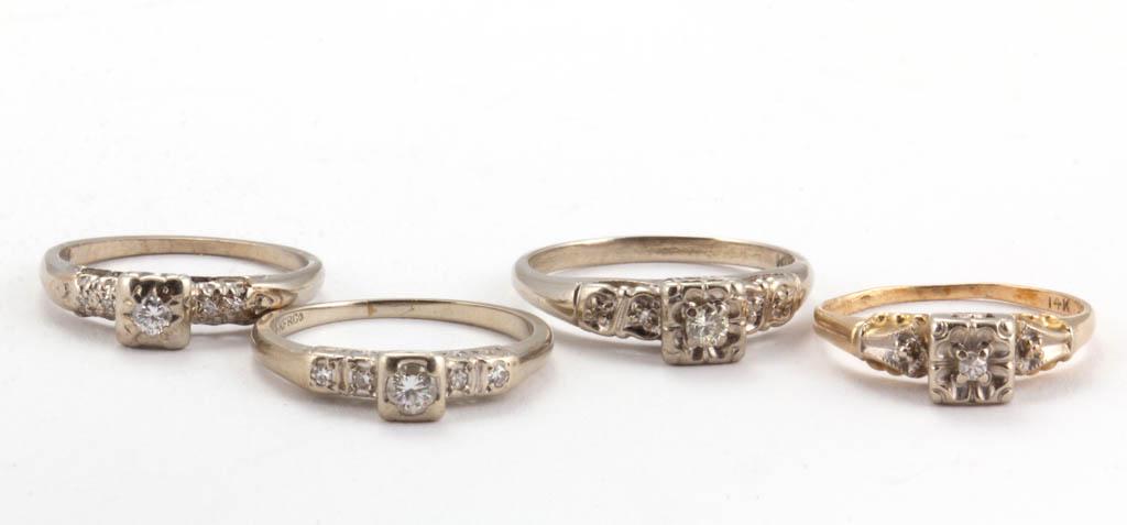 14K GOLD AND DIAMOND SOLITAIRE LADY'S RINGS, LOT OF: 14K GOLD AND DIAMOND SOLITAIRE LADY'S RINGS, LOT OF FOUR, comprising three examples with each having a melee or round-cut diamond in a square illusion setting, two featuring four accent diamond melee 