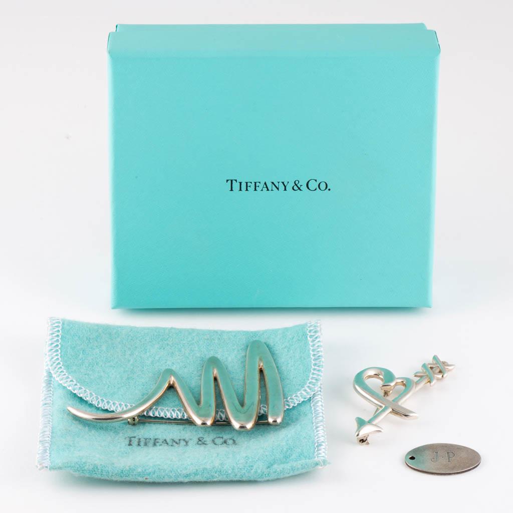 PALOMA PICASSO TIFFANY & CO. STERLING SILVER BROOCHES,: PALOMA PICASSO TIFFANY & CO. STERLING SILVER BROOCHES, LOT OF TWO, comprising a "Graffiti" heart & arrow example and a zig zag scribble example. Each with "(c) Paloma Picasso TIFFANY & CO. 925" mark. 