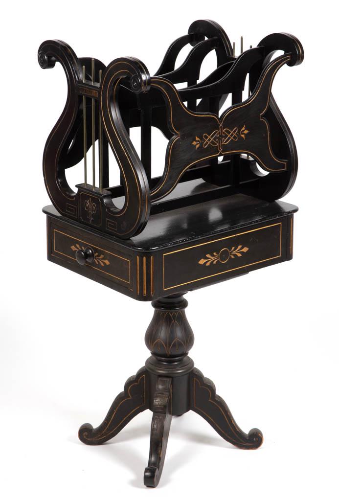 VICTORIAN EBONIZED MUSIC STAND: VICTORIAN EBONIZED MUSIC STAND, divided lyre form rack with single drawer below, raised on a baluster-form pedestal supported by four legs. Pine and poplar secondary woods. Old ebonized surface with g