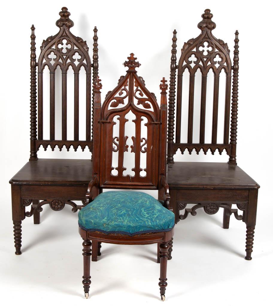 PAIR OF CARVED WALNUT GOTHIC-STYLE SIDE CHAIRS: PAIR OF CARVED WALNUT GOTHIC-STYLE SIDE CHAIRS, featuring pierced backs, and elaborate carvings and turnings. Retains likely original finish with warm color. Together with another Gothic-style side ch