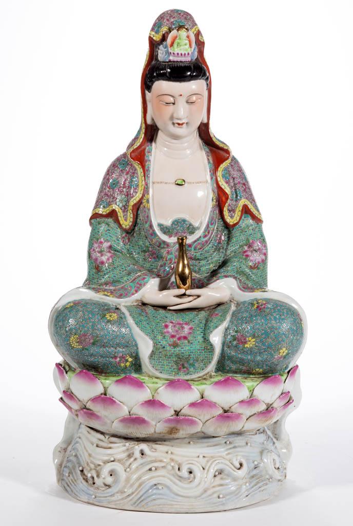 CHINESE EXPORT PORCELAIN FAMILLE ROSE GUANYIN FIGURE: CHINESE EXPORT PORCELAIN FAMILLE ROSE GUANYIN FIGURE, sitting cross-legged on a lotus flower with serene expression, hands in lap holding a gilt water jar, and wearing a crown with shroud, having plea