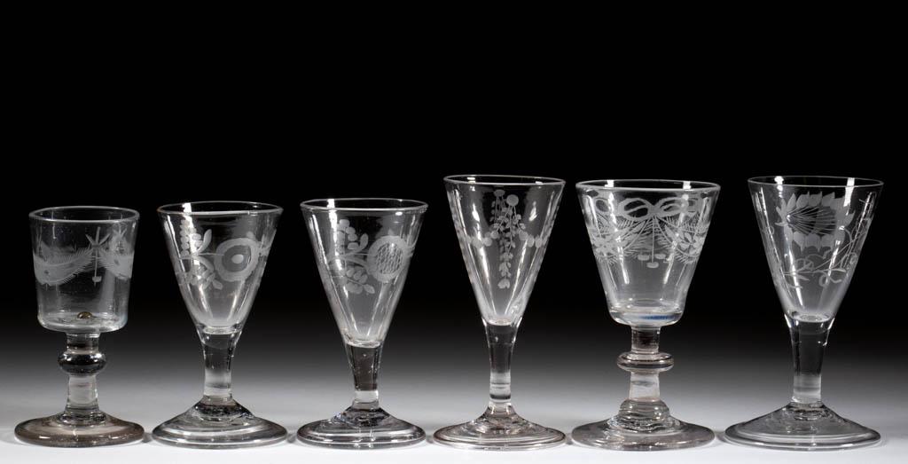 ASSORTED FREE-BLOWN AND ENGRAVED WINE GLASSES, LOT OF: ASSORTED FREE-BLOWN AND ENGRAVED WINE GLASSES, LOT OF SIX, colorless lead glass, conical, round funnel, and square bucket bowls, various floral and drape engravings, two with a bird, raised on drawn, 