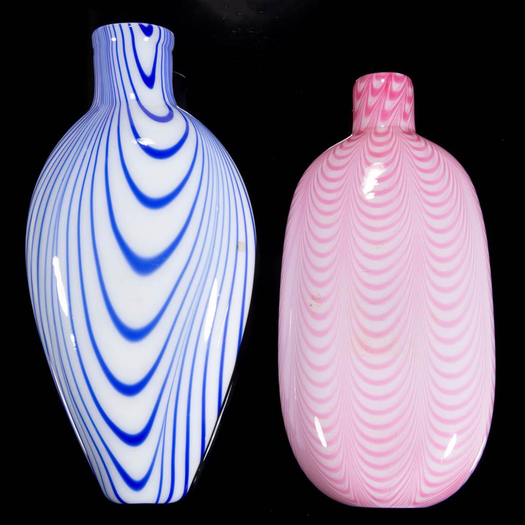 FREE-BLOWN AND MARBRIE-DECORATED FLASKS, LOT OF TWO: FREE-BLOWN AND MARBRIE-DECORATED FLASKS, LOT OF TWO, opaque white, comprising an ovoid form with four groupings of blue loopings, and an oval form with eight groups of rose loopings. United States or