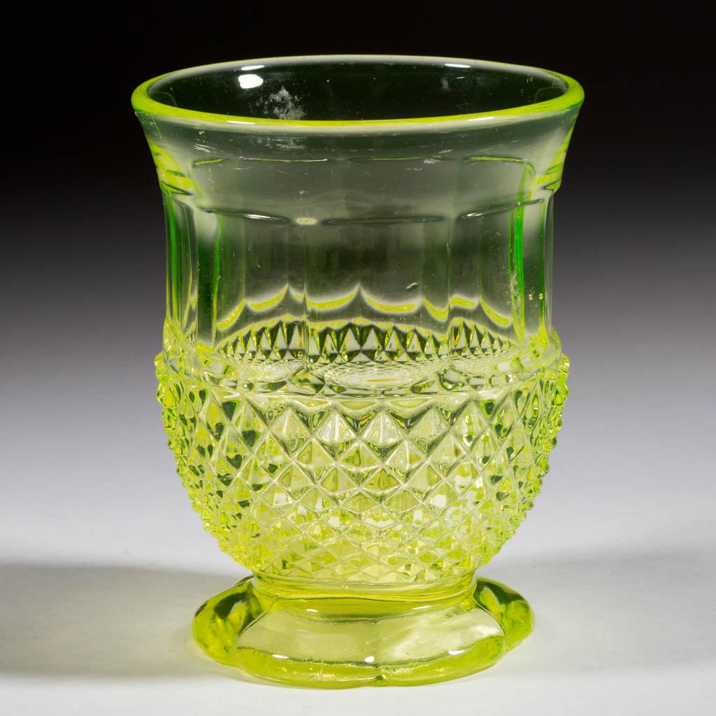 HINOTO / DIAMOND POINT WITH PANELS FOOTED TUMBLER: HINOTO / DIAMOND POINT WITH PANELS FOOTED TUMBLER, Canary (reacts under black light), goblet-form bowl raised on a six-petal foot with polished pontil mark. Boston & Sandwich Glass Co. 1850-1870. 4 1/