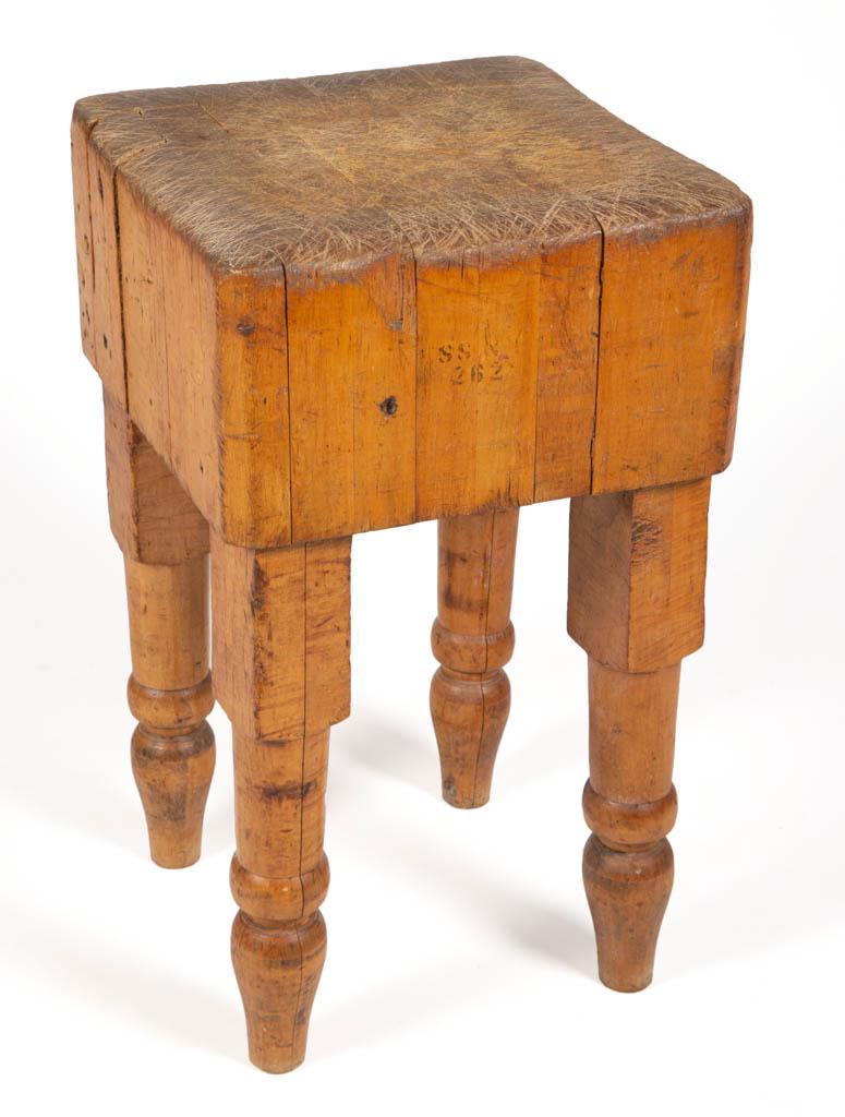 AMERICAN COUNTRY MAPLE BUTCHER'S BLOCK: AMERICAN COUNTRY MAPLE BUTCHER'S BLOCK, solid block of laminated construction, four removable turned-legs. Late 19th/first quarter 20th century. 30 1/2" H, 17 1/2" x 17 1/2" top. Good overall conditio