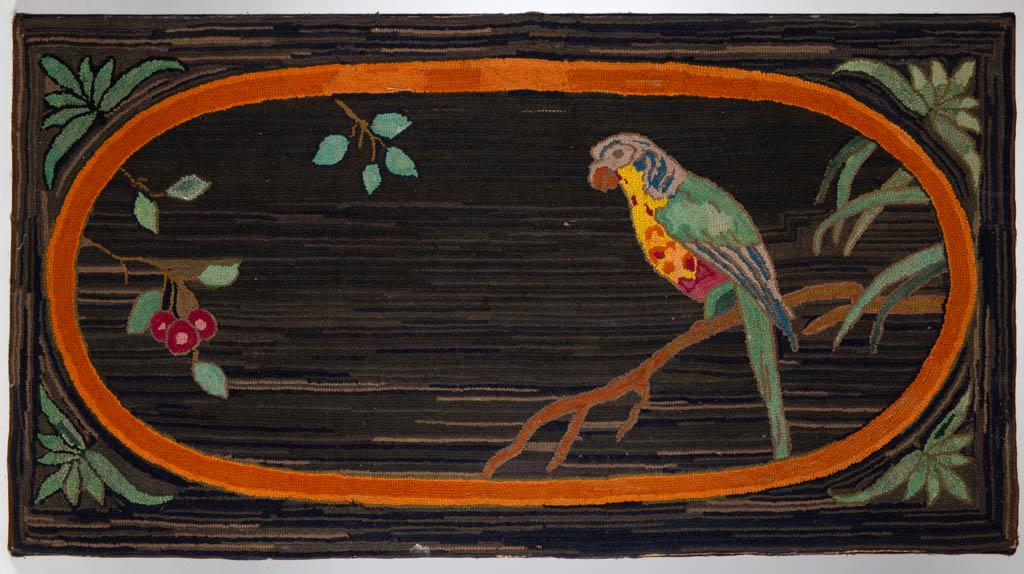 AMERICAN FOLK ART PICTORIAL HOOKED RUG: AMERICAN FOLK ART PICTORIAL HOOKED RUG, wool on burlap, large rectangular format, design featuring a polychrome parrot perched on a branch within an orange elliptical reserve, green foliate corner dev