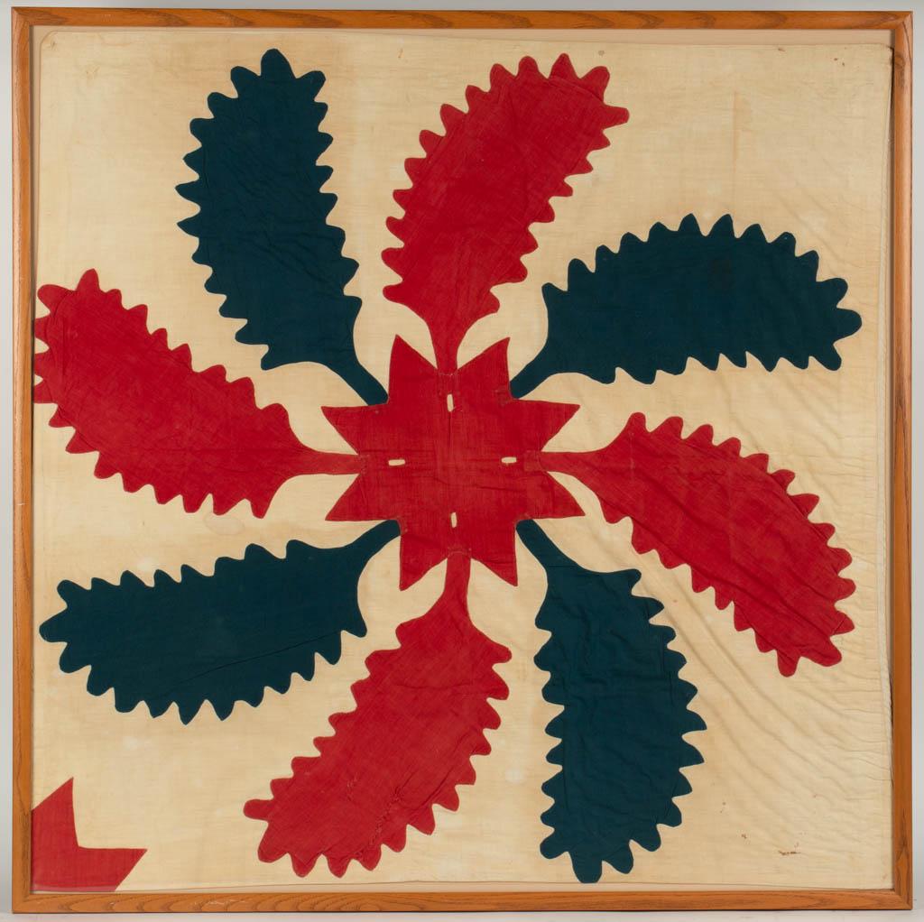 AMERICAN "PRINCESS FEATHER" VARIANT APPLIQUE QUILT: AMERICAN "PRINCESS FEATHER" VARIANT APPLIQUE QUILT BLOCK, white ground with red and green solids, eight large princess feathers and a central star, probably reduced from a larger quilt. Housed under g
