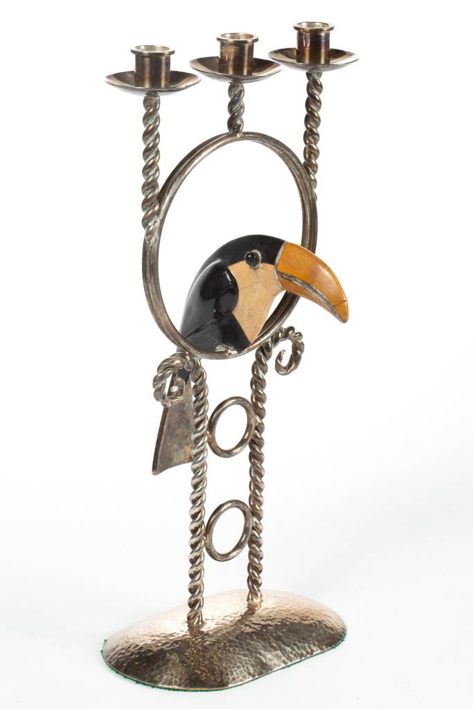 EMILIA CASTILLO (MEXICAN), ATTRIBUTED, SILVER-PLATED: EMILIA CASTILLO (MEXICAN), ATTRIBUTED, SILVER-PLATED FIGURAL CANDELABRA, featuring a toucan made up in a mosaic-fashion with pieces of inlaid semi-precious stones, no markings located. Circa 1980. 16 