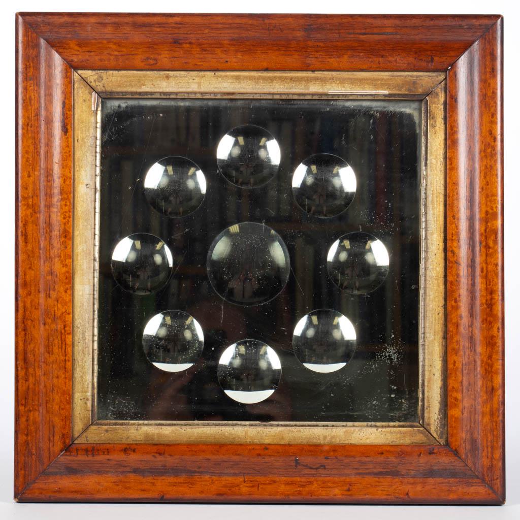 ENGLISH OR CONTINENTAL VICTORIAN WALL MIRROR: ENGLISH OR CONTINENTAL VICTORIAN WALL MIRROR, mirror comprising eight outer convex mirrors with one central convex mirror. Housed in likely original period frame. Fourth quarter 19th century. 16" x 16