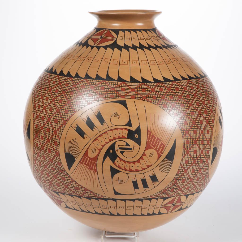 NATIVE AMERICAN MATA ORTIZ SIGNED "CESAR BUGARINI": NATIVE AMERICAN MATA ORTIZ SIGNED "CESAR BUGARINI" POTTERY LARGE OLLA JAR, having rounded bottom, featuring polychrome hand-painted stylistic birds with geometric designs. Fourth quarter 20th century.