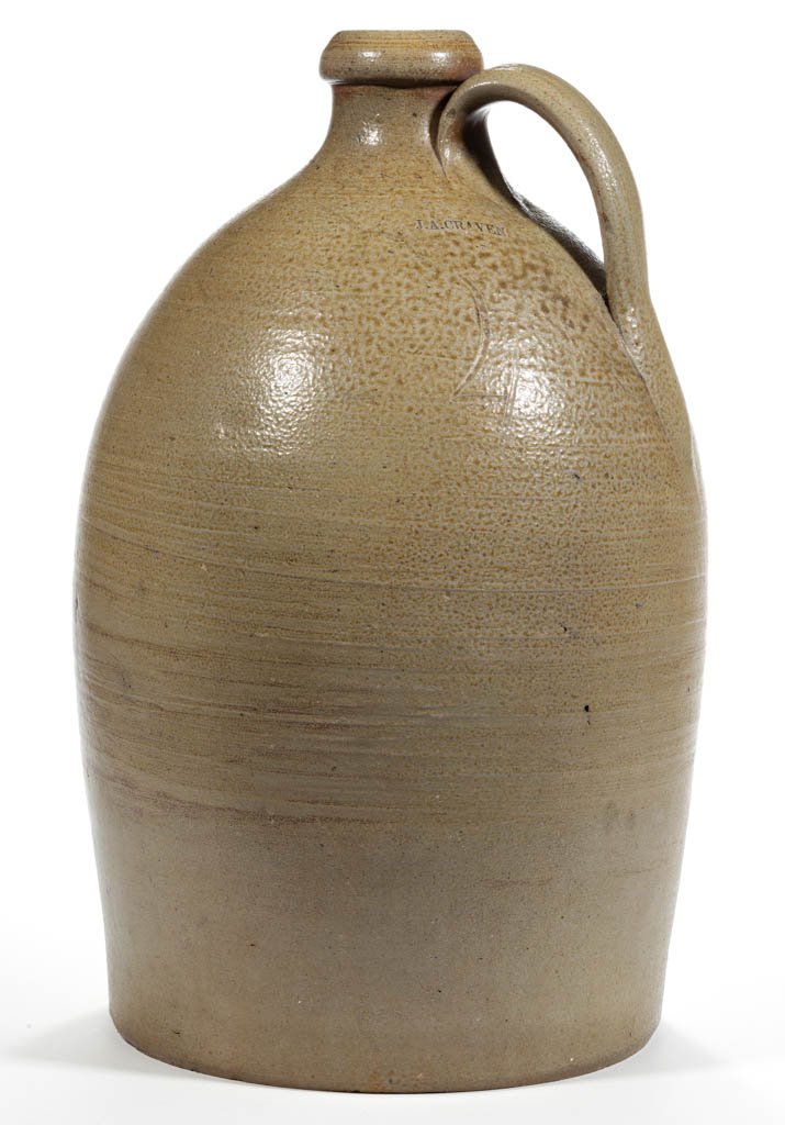STAMPED "J.A. CRAVEN", RANDPOLPH CO., NORTH CAROLINA: STAMPED "J.A. CRAVEN", RANDPOLPH CO., NORTH CAROLINA STONEWARE JUG, salt-glazed, incised "4" gallon capacity, ovoid form with bold, rounded mouth and strap handle. John Anderson Craven (1824-1859), Ra