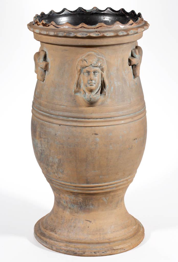 AMERICAN EARTHENWARE / REDWARE UMBRELLA STAND: AMERICAN EARTHENWARE / REDWARE UMBRELLA STAND, unglazed exterior, baluster form with scalloped rim, having applied branch-like handles to each side and molded faces to front and back, dark Albany-slip