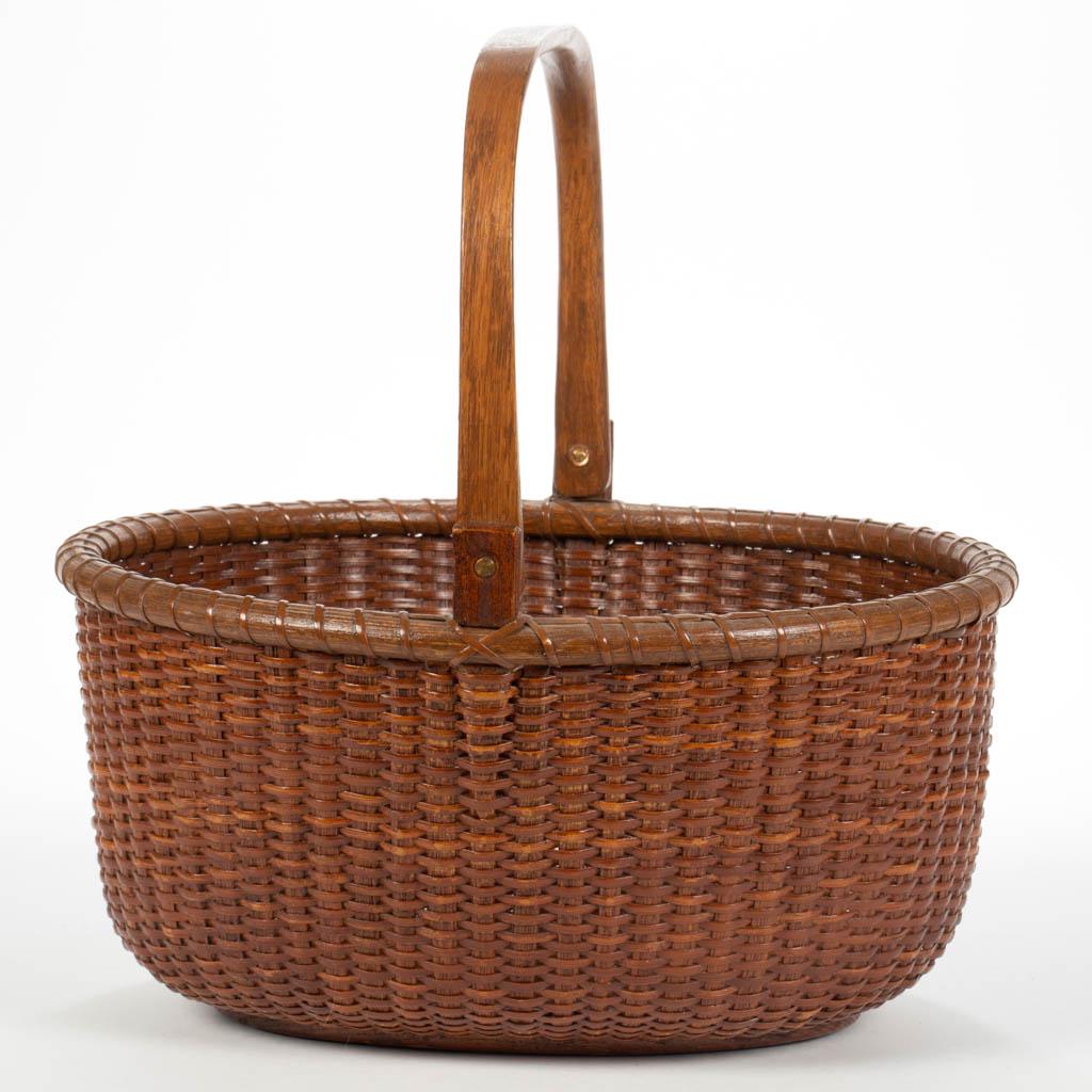 JOSE FORMOSO REYES (1902-1980) NANTUCKET LIGHTSHIP: JOSE FORMOSO REYES (1902-1980) NANTUCKET LIGHTSHIP BASKET, stave-type oval form with single wrapped rim, shaped swing handle, and wooden bottom, signed and inscribed to underside, signed "MADE IN / NA