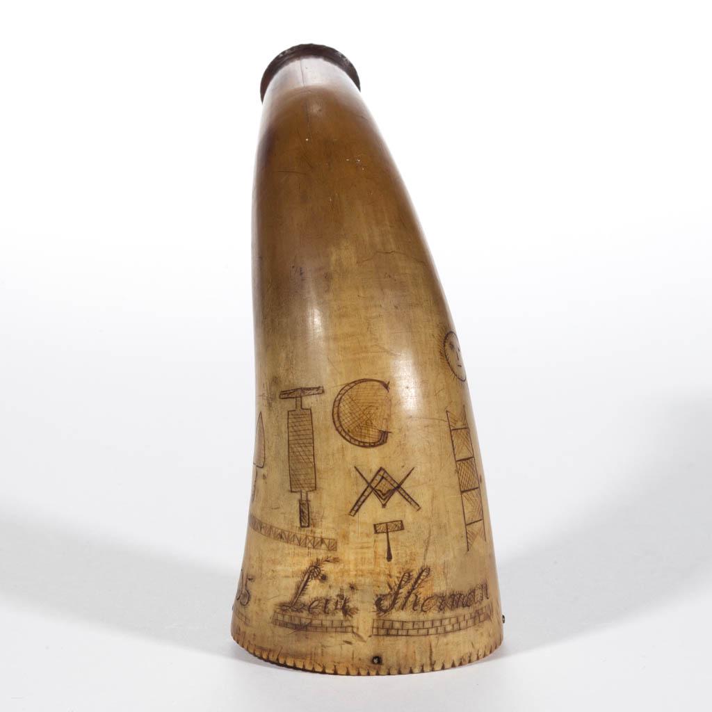 AMERICAN SCRIMSHAWED AND CARVED POWDER HORN / MEASURE: AMERICAN SCRIMSHAWED AND CARVED POWDER HORN / MEASURE, inscribed "Levi Sherman / May 14th 1805", featuring Masonic symbols including Master Mason, Jacob's Ladder, and Square and Compass, having flat w