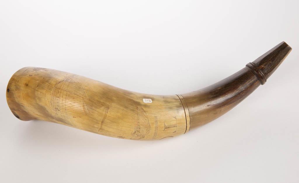 AMERICAN SCRIMSHAWED AND CARVED CROW'S NEST POWDER HORN: AMERICAN SCRIMSHAWED AND CARVED CROW'S NEST POWDER HORN, inscribed "TOS / 1847", featuring an eagle clutching arrows flyer over a clipper ship flying a patriotic pennant, likely original wooden plug w