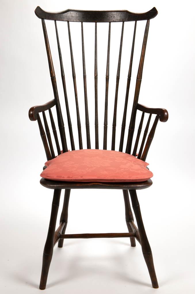 AMERICAN PAINTED WINDSOR FAN-BACK ARMCHAIR: AMERICAN PAINTED WINDSOR FAN-BACK ARMCHAIR, bamboo turned, the high, seven-spindle back with shaped crest, short carved arms above two spindles, above a saddle-form seat raised on splayed legs joined 