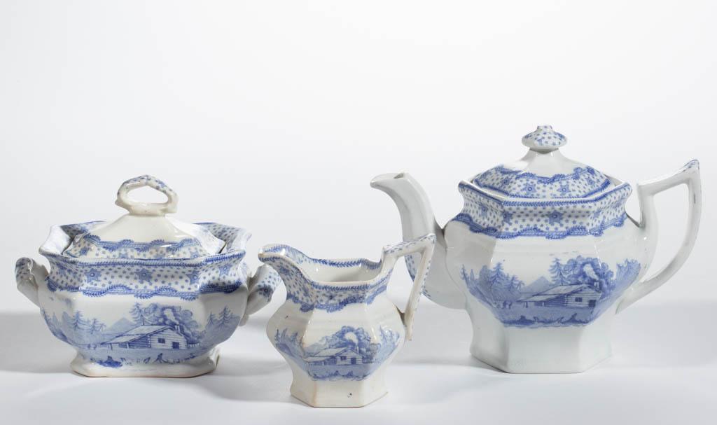 ENGLISH STAFFORDSHIRE TRANSFER-PRINTED AMERICAN: ENGLISH STAFFORDSHIRE TRANSFER-PRINTED AMERICAN HISTORICAL CERAMIC CHILD'S THREE-PIECE TEA SET, comprising a teapot, a covered sugar, and a creamer, each having light blue transfer design "Columbian S