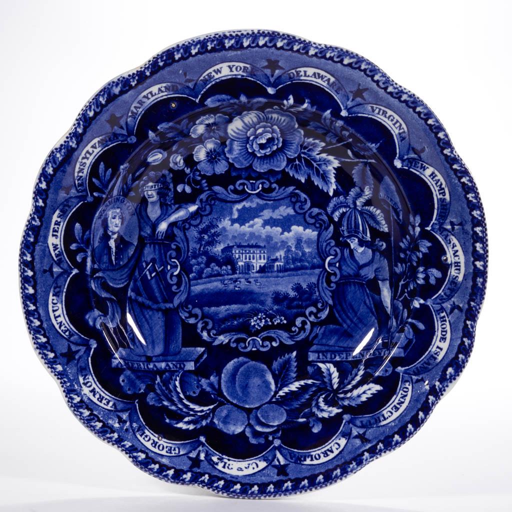 ENGLISH STAFFORDSHIRE PEARLWARE TRANSFER-PRINTED: ENGLISH STAFFORDSHIRE PEARLWARE TRANSFER-PRINTED AMERICAN HISTORICAL CERAMIC SOUP PLATE, having dark blue transfer "States Series" #02 pattern and scalloped rim, featuring a manor home identified as B