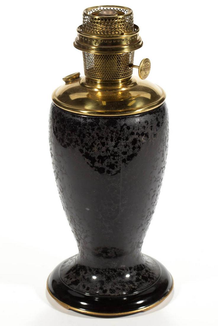 ALADDIN NO. 1248 VENETIAN ART-CRAFT KEROSENE VASE LAMP: ALADDIN NO. 1248 VENETIAN ART-CRAFT KEROSENE VASE LAMP, Ebony with a sanded texture, color fused to the interior, gilt tracing to the edge of the foot. Fitted with a brass drop-in font and complete Mo