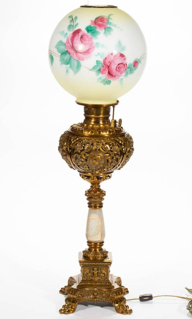 VICTORIAN CAST-METAL AND MARBLE KEROSENE BANQUET LAMP: VICTORIAN CAST-METAL AND MARBLE KEROSENE BANQUET LAMP, late opaque white ball shade with shaded yellow ground and polychrome floral decoration, later heat ring, font vase having four reserves consisti