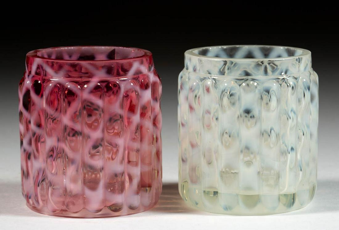 RIBBED OPAL LATTICE TOOTHPICK HOLDERS, LOT OF TWO: RIBBED OPAL LATTICE TOOTHPICK HOLDERS, LOT OF TWO, comprising a cranberry opalescent and a colorless opalescent, each with a factory-polished rim. Maker unverified, possibly Northwood Glass Co. Circa 