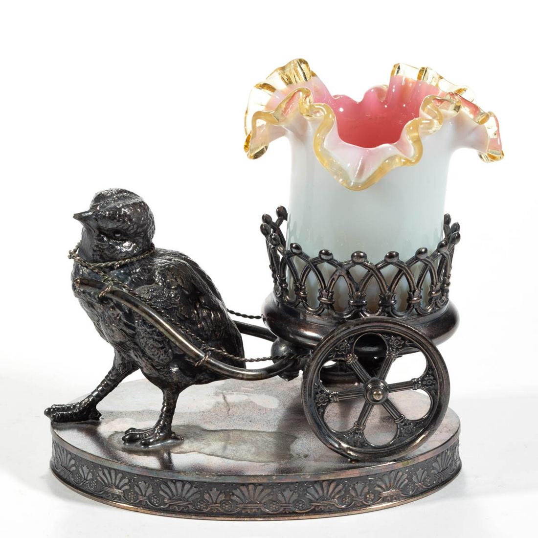VICTORIAN CASED GLASS TOOTHPICK HOLDER: VICTORIAN CASED GLASS TOOTHPICK HOLDER, white cased rose, cylindrical-form with an applied amber ruffled rim, fitted into a quadruple-plate stand featuring a chick pulling a cart and marked for "J. W.