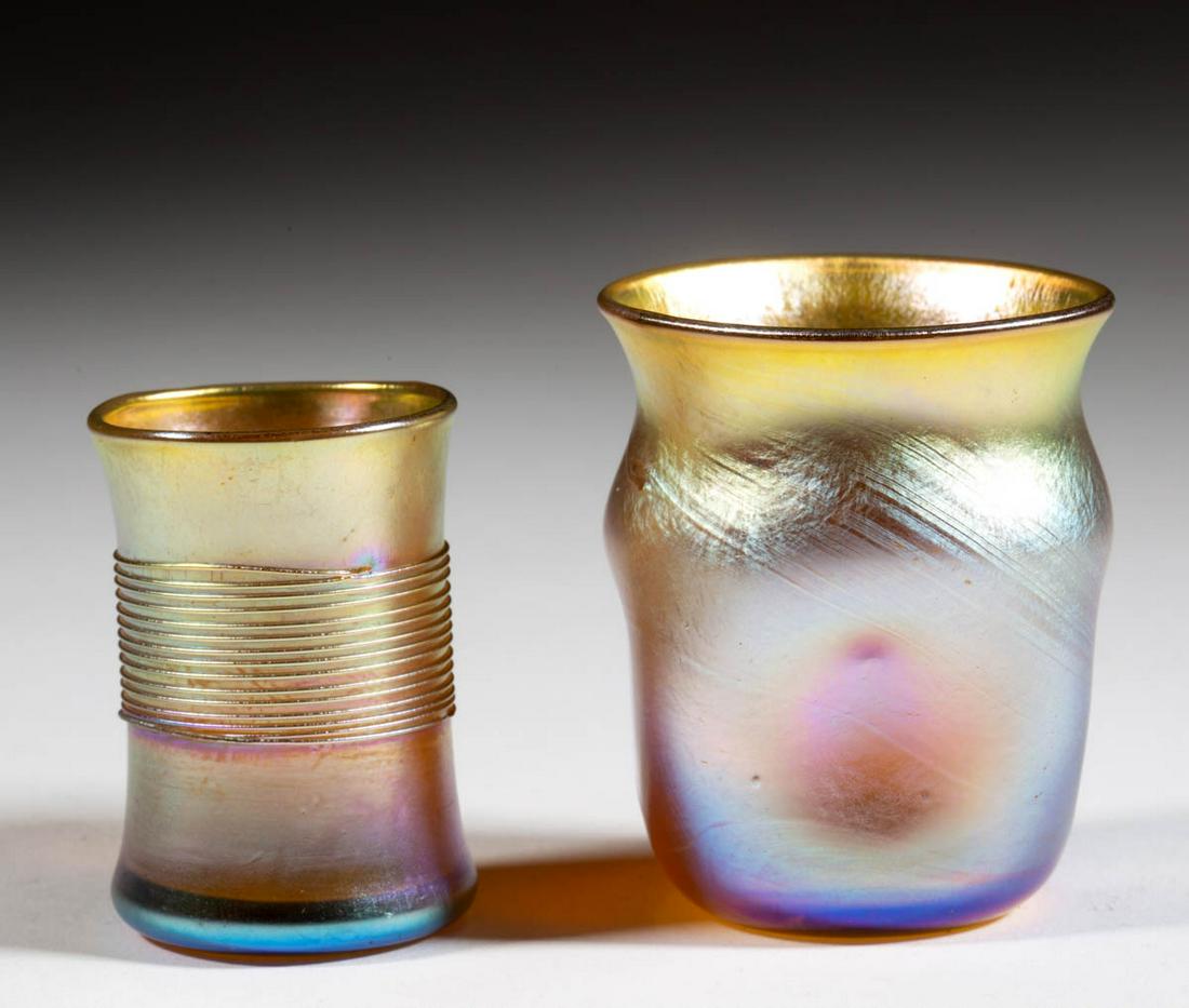 TIFFANY FAVRILE IRIDESCENT ART GLASS TOOTHPICK HOLDERS,: TIFFANY FAVRILE IRIDESCENT ART GLASS TOOTHPICK HOLDERS, LOT OF TWO, golden iridescent, comprising a dimpled sides and a threaded example, dimpled signed "L.C.T. O2629", threaded signed "L.C.T. T5904".