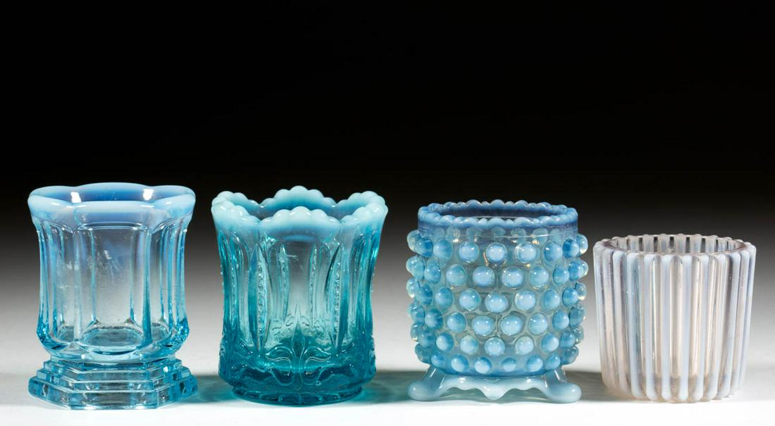 ASSORTED PRESSED OPALESCENT GLASS TOOTHPICK HOLDERS,: ASSORTED PRESSED OPALESCENT GLASS TOOTHPICK HOLDERS, LOT OF FOUR, blue opalescent, comprising a Beatty Rib, a Beatty Hobnail, an Iris and Meander, and a Colonial Stairsteps. Various makers. Late 19th/