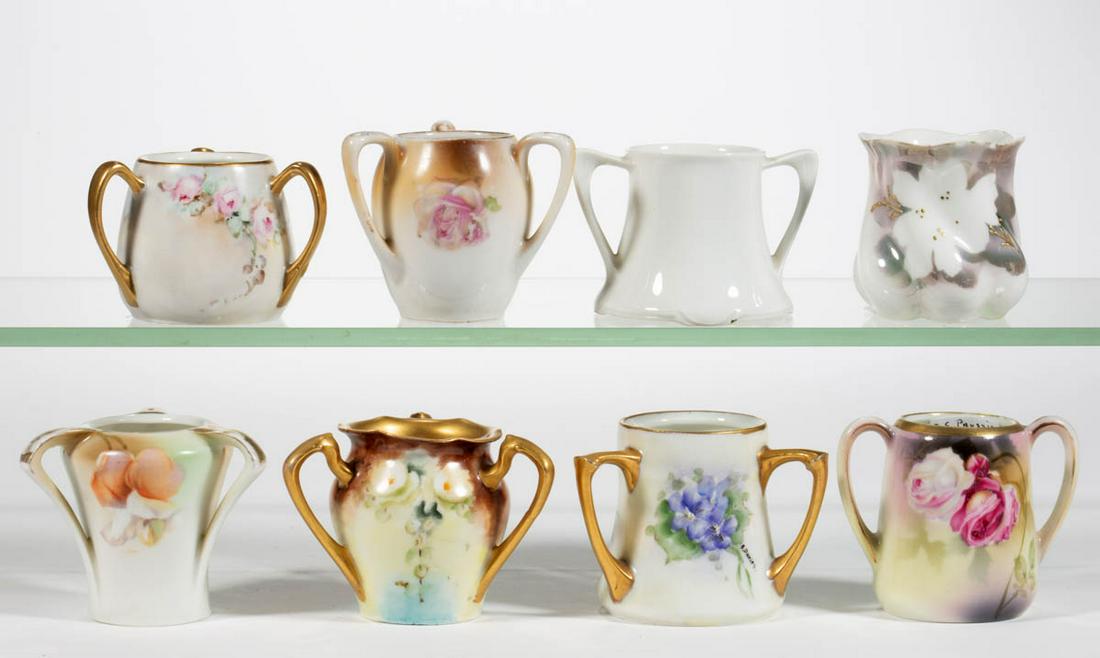 R.S. GERMANY PORCELAIN TOOTHPICK HOLDERS, LOT OF EIGHT: R.S. GERMANY PORCELAIN TOOTHPICK HOLDERS, LOT OF EIGHT, including five having three vertical handles with polychrome floral decorations, including three signed hand-painted examples, signatures includ